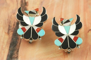 Genuine Sleeping Beauty Turquoise, Mother of Pearl, Jet and Coral inlaid between ribbons of Sterling Silver. Beautiful Thunderbird Design clip on earrings created by a member of the Zuni Tribe. 